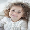 Joyful Child Portrait with Curly Hair and Bright Smile