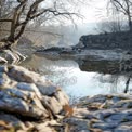 Tranquil River Landscape with Reflections and Rocky Shoreline