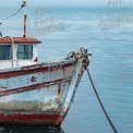 Rustic Fishing Boat Docked on Calm Waters - Tranquil Maritime Scene