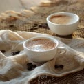 Cozy Coffee Moments: Warm Cups of Brew with Coffee Beans on Rustic Table