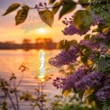 Serene Sunset Over Water with Lilac Blossoms in Bloom