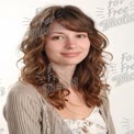 Natural Beauty Portrait of Young Woman with Curly Hair