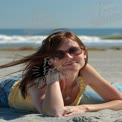 Relaxing Beach Vibes: Young Woman Enjoying Summer Sunshine