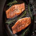 Fresh Salmon Fillets with Herbs on a Rustic Plate