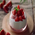 Delicious Strawberry Dessert in Elegant Glass Bowl with Fresh Mint Garnish