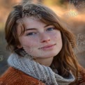 Natural Beauty Portrait of a Young Woman with Freckles and Soft Lighting