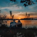 Romantic Sunset by the Lake: Couples Relaxing in Nature