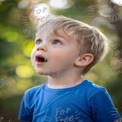 Wonder and Curiosity: Young Boy Gazing in Awe Outdoors