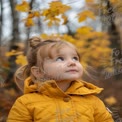 Charming Child in Autumn Forest with Golden Leaves