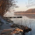 Tranquil Winter Landscape by the River: Serene Pathway and Reflections