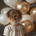 Charming Child with Balloons: Celebration, Joy, and Childhood Moments