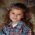 Charming Young Girl with Curly Hair in Colorful Plaid Shirt - Portrait of Innocence and Joy