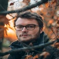 Autumn Portrait of a Thoughtful Young Man in Nature