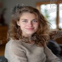 Natural Beauty Portrait of a Young Woman with Curly Hair and Bright Blue Eyes