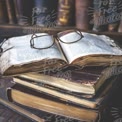 Vintage Books and Reading Glasses on a Stack of Old Literature