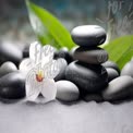 Zen Garden Serenity: Stacked Stones and Orchid Flower for Relaxation and Wellness