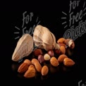 Assorted Nuts and Seeds on Black Background - Healthy Snack Concept