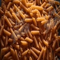 Close-Up of Raw Penne Pasta: Culinary Ingredients for Italian Cooking