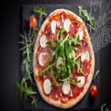 Delicious Gourmet Pizza with Fresh Arugula, Mozzarella, and Salami on Slate Board