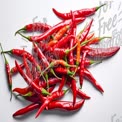 Fresh Red Chili Peppers on White Background - Spicy Ingredients for Cooking and Culinary Arts