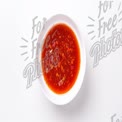 Vibrant Spicy Sauce in White Bowl - Perfect for Culinary Creations