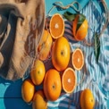 Fresh Oranges and Citrus Fruits on Blue Wooden Table with Textiles