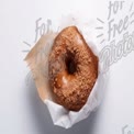 Delicious Glazed Donut with Crumb Topping on White Background