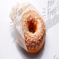 Delicious Gourmet Donut with Crumble Topping in Elegant Packaging