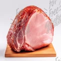 Freshly Cured Ham on Wooden Cutting Board - Gourmet Meat Photography