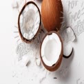 Fresh Coconut Halves with Shredded Coconut on White Background