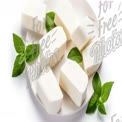 Fresh Mozzarella Cheese with Basil Leaves on White Plate