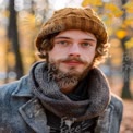 Cozy Autumn Portrait of a Young Man in Nature with Warm Hat and Scarf