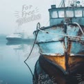 Serene Foggy Harbor with Rustic Fishing Boats