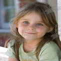 Joyful Child Portrait with Bright Blue Eyes and Natural Smile