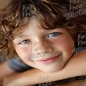 Joyful Child Portrait with Freckles and Bright Blue Eyes