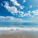 Tranquil Ocean Waves Under a Bright Blue Sky