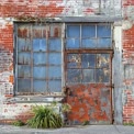 Rustic Urban Doorway: Weathered Charm of an Abandoned Building