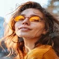 Radiant Young Woman with Sunglasses Enjoying a Sunny Day