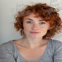 Natural Beauty Portrait of a Freckled Redhead with Curly Hair