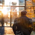 Businessman Enjoying Sunset in Urban Setting - Professional Reflection and Inspiration