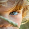 Close-Up of Child's Eye with Natural Background: Innocence and Curiosity