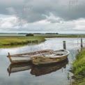 Serene Landscape with Rustic Boats on Calm Water Under Dramatic Clouds