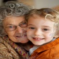 Heartwarming Generational Bond: Grandmother and Grandchild Smiling Together