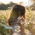 Serene Summer Bliss: Young Woman in Flower Field at Sunset