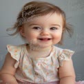 Joyful Baby Portrait with Natural Smile and Playful Hair