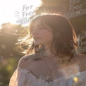 Serene Portrait of a Young Woman in Nature with Sunlight Glow