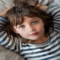 Charming Child Portrait with Striking Blue Eyes and Casual Style