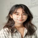 Natural Beauty Portrait of a Young Woman with Glasses in Soft Lighting