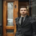 Confident Businessman in Stylish Suit by Elegant Doorway