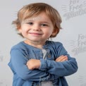 Confident Smiling Toddler with Stylish Hair and Casual Outfit